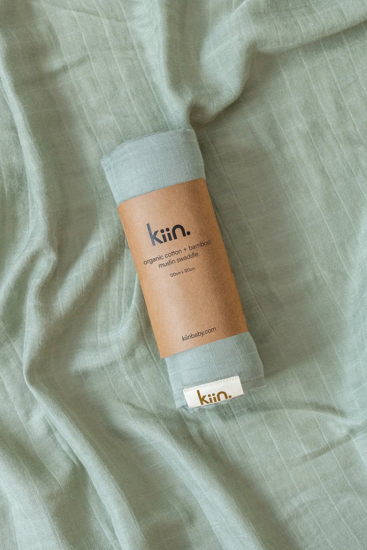 Organic muslin baby swaddle in sage green
soft newborn essential and baby shower gift. 
Breathable organic cotton bamboo swaddle for hospital bags and newborn sleep.
